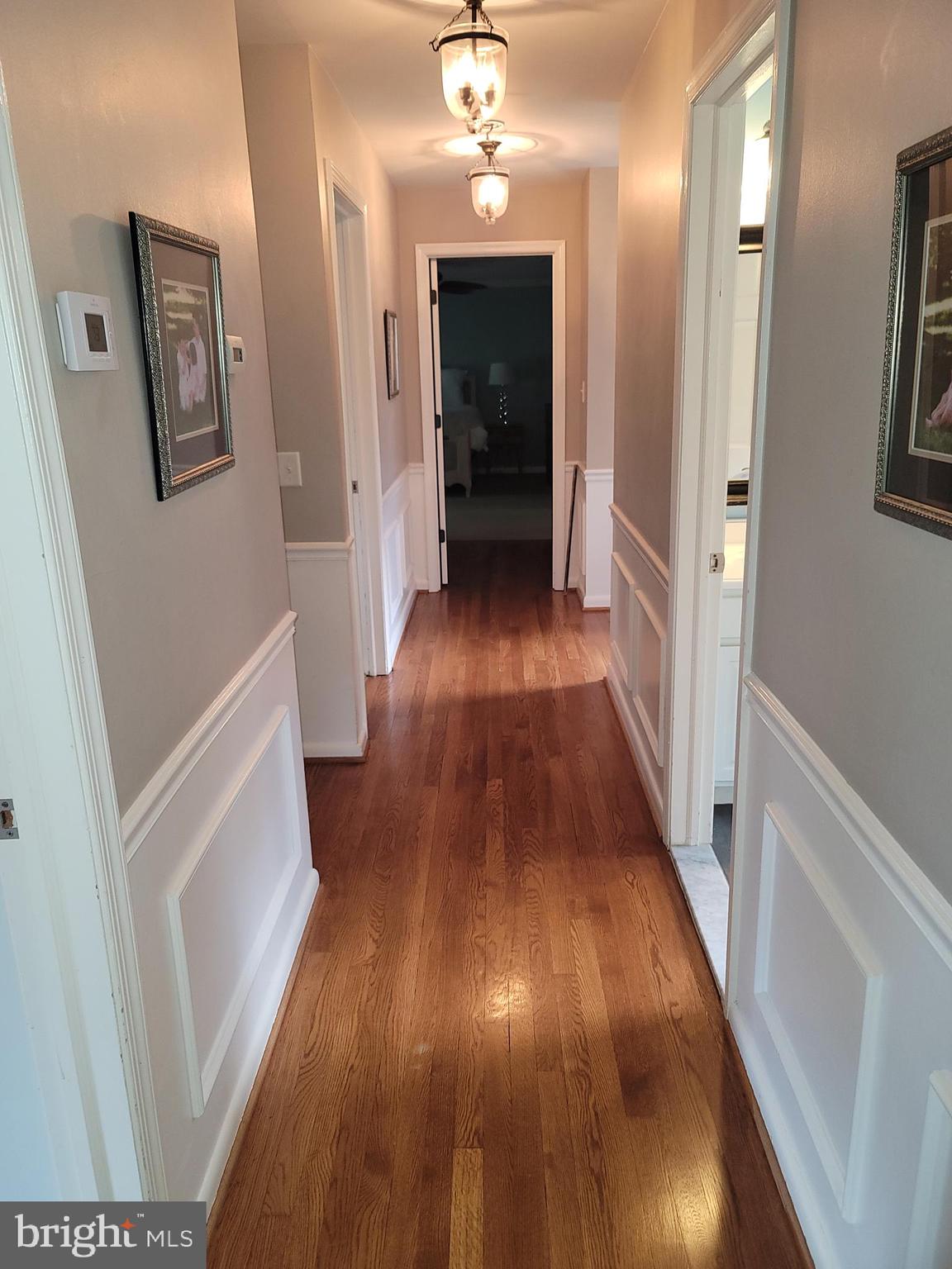 2424 Stanwick Road Phoenix, MD 21131 - Photo 43 of 67 a view of a hallway with wooden floor and staircase