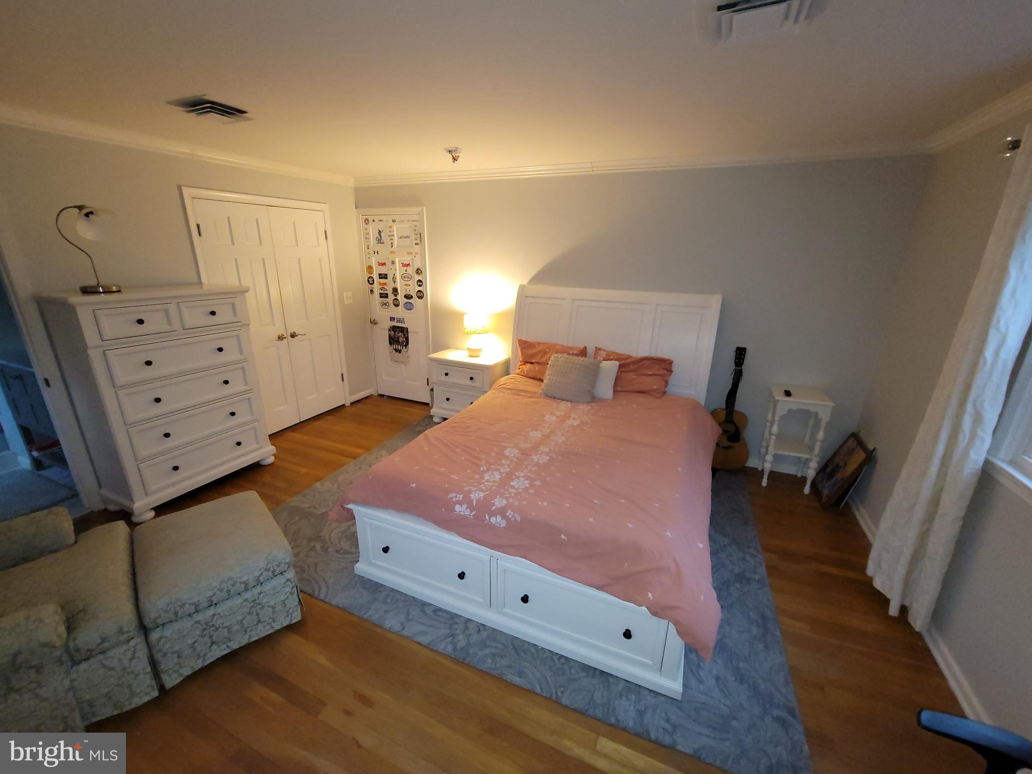 2424 Stanwick Road Phoenix, MD 21131 - Photo 44 of 67 a bed room with a bed and a dresser