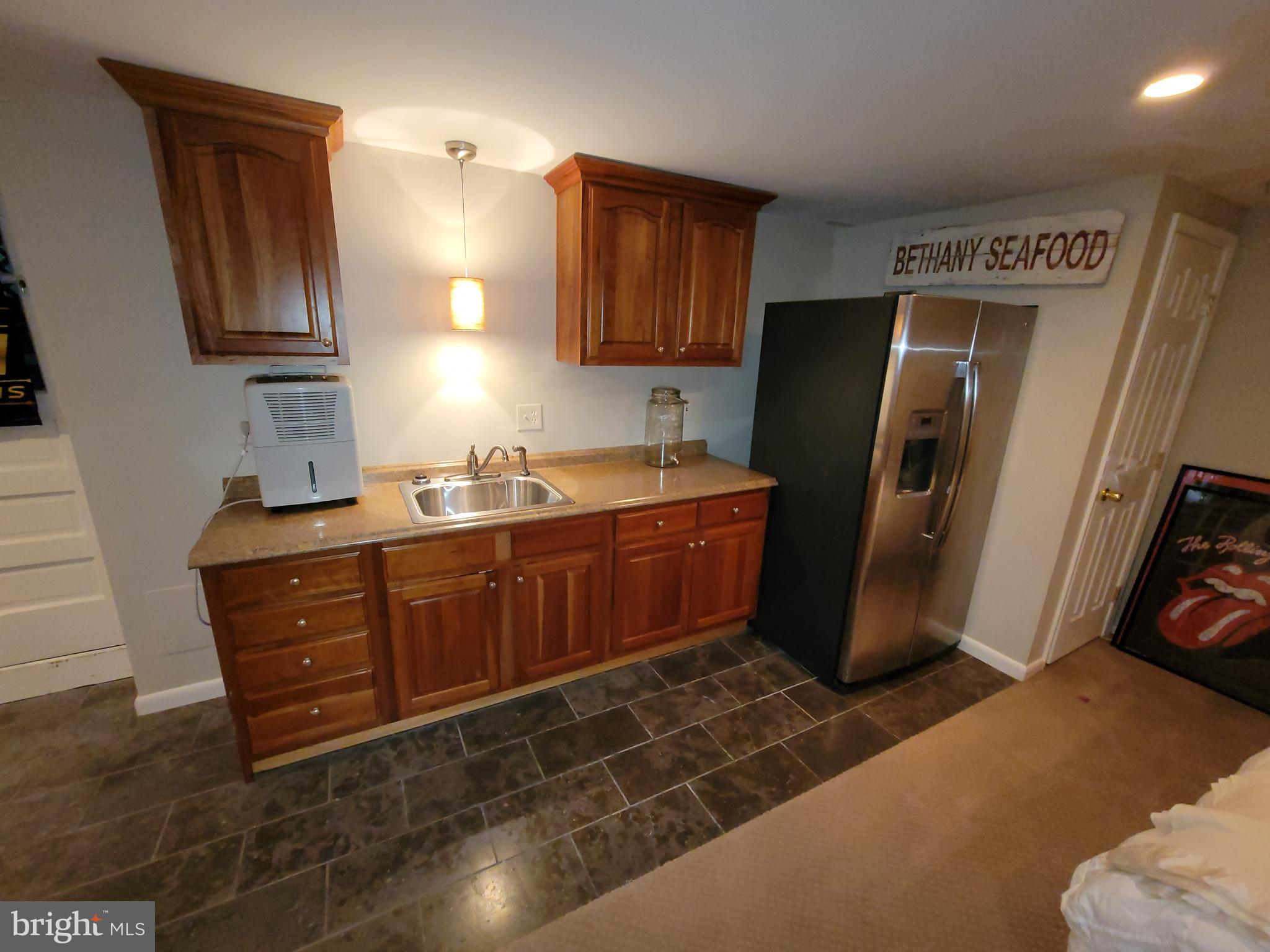 2424 Stanwick Road Phoenix, MD 21131 - Photo 51 of 67 a kitchen with stainless steel appliances granite countertop a refrigerator and a sink