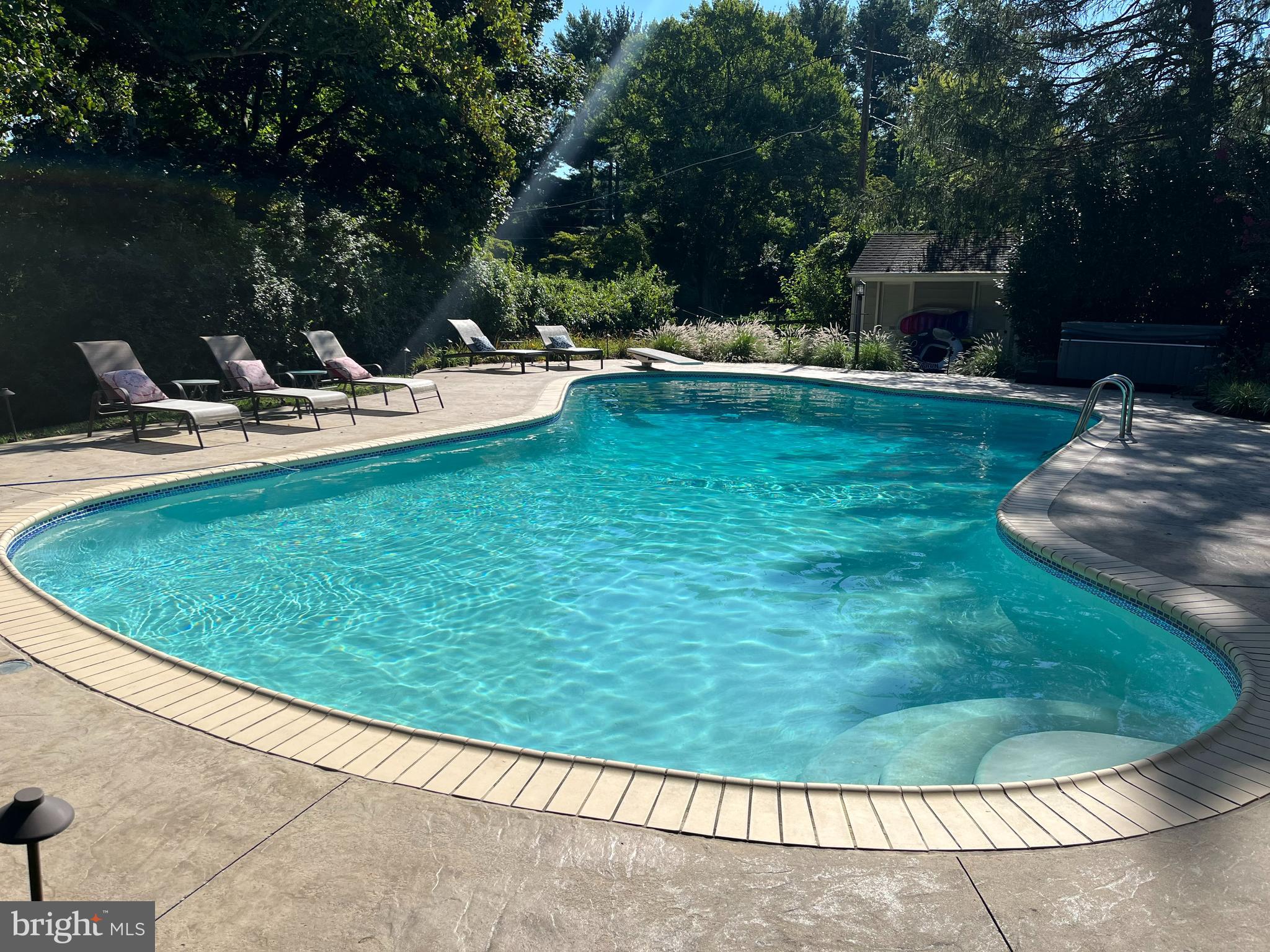 2424 Stanwick Road Phoenix, MD 21131 - Photo 58 of 67 a view of a swimming pool with a patio