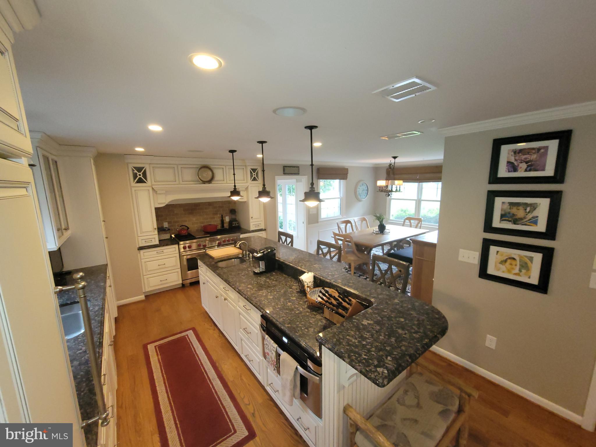 2424 Stanwick Road Phoenix, MD 21131 - Photo 7 of 67 a large kitchen with stainless steel appliances granite countertop a sink stove and refrigerator