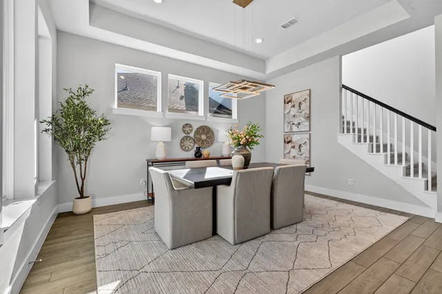 a living room with furniture and flowers