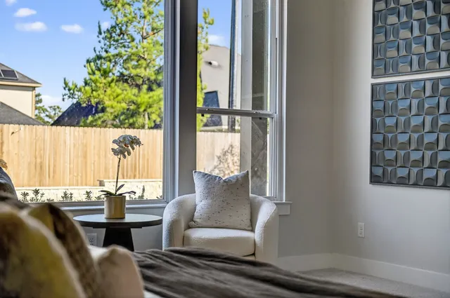 a view of a living room with a table and chair