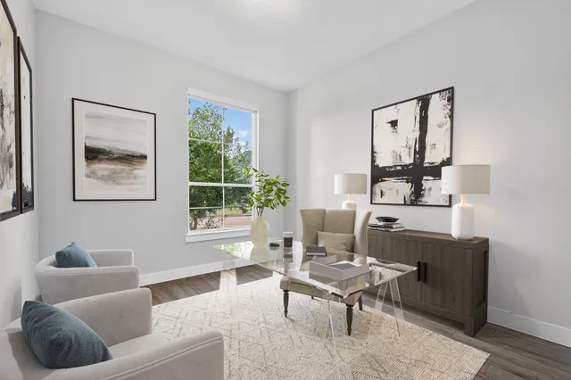 a living room with furniture and a window