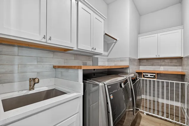 a view of a kitchen with sink and dishwasher