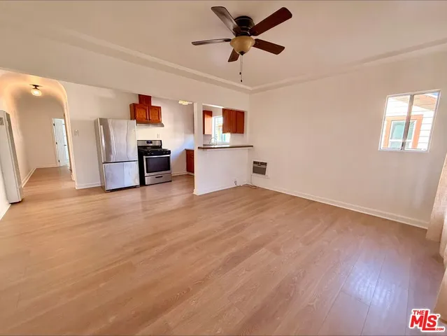 a view of a kitchen with a sink and a window