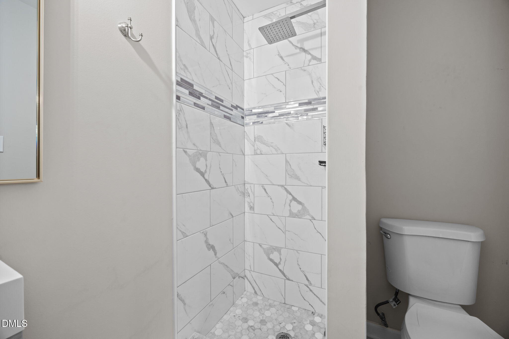 2950 Glenridge Drive Raleigh, NC 27604 - Photo 23 of 53 a bathroom with a toilet and a shower