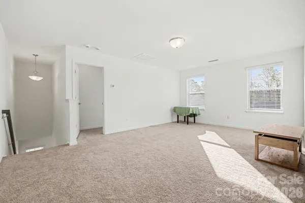 a spacious bedroom with a bed and a couch