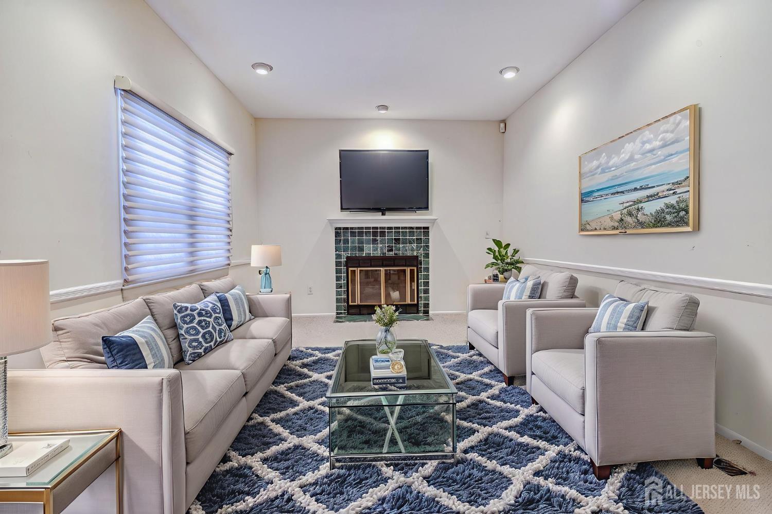 61 Ochs Avenue Milltown, NJ 08850 - Photo 12 of 29 a living room with furniture and a flat screen tv