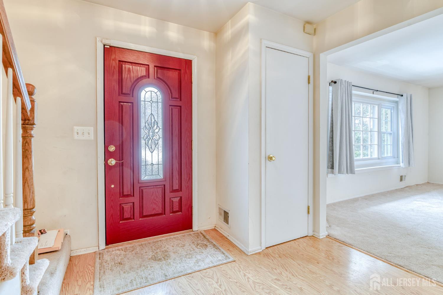 61 Ochs Avenue Milltown, NJ 08850 - Photo 13 of 29 a view of front door with a mirror