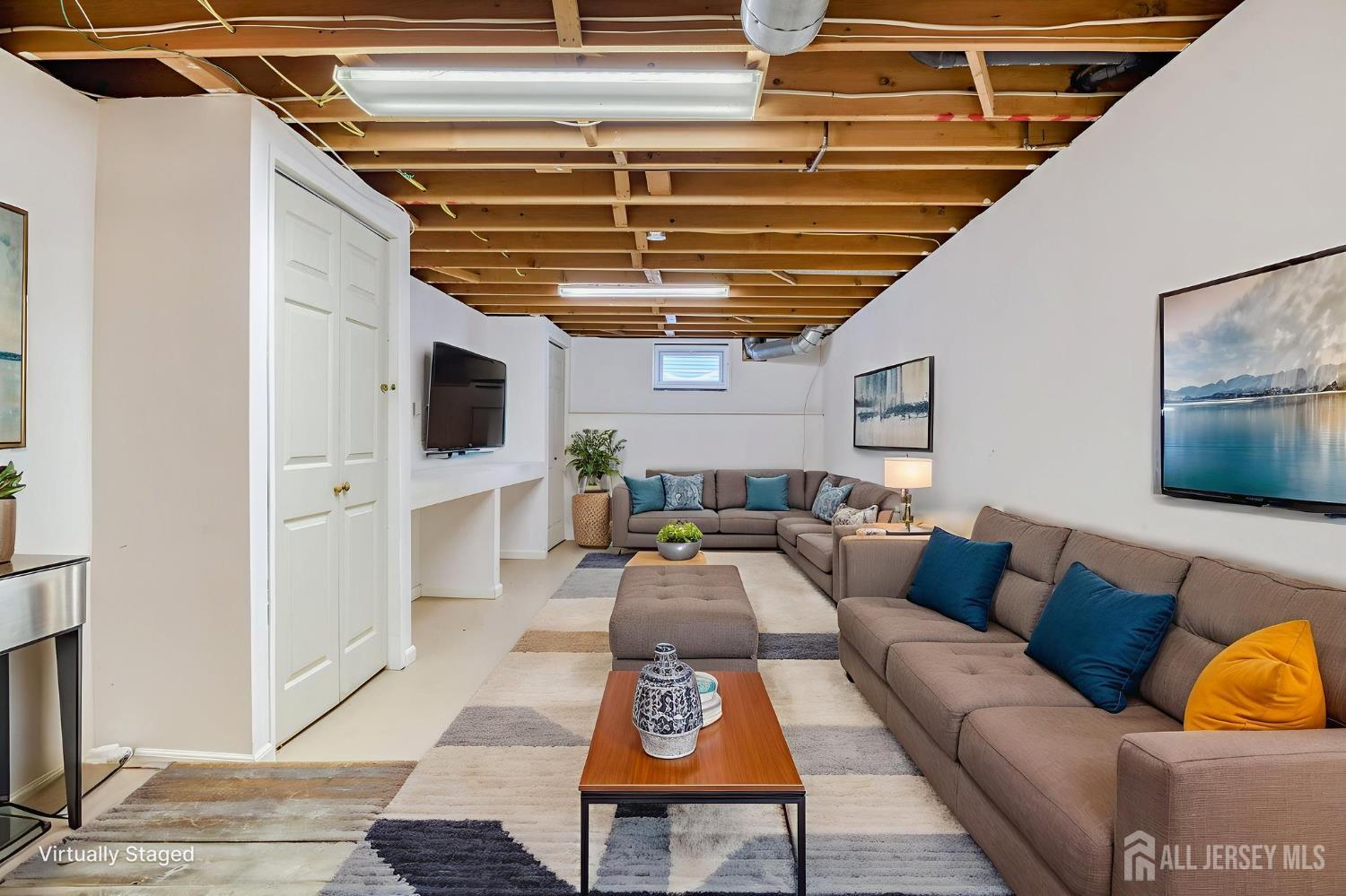 61 Ochs Avenue Milltown, NJ 08850 - Photo 15 of 29 a living room with furniture and a flat screen tv