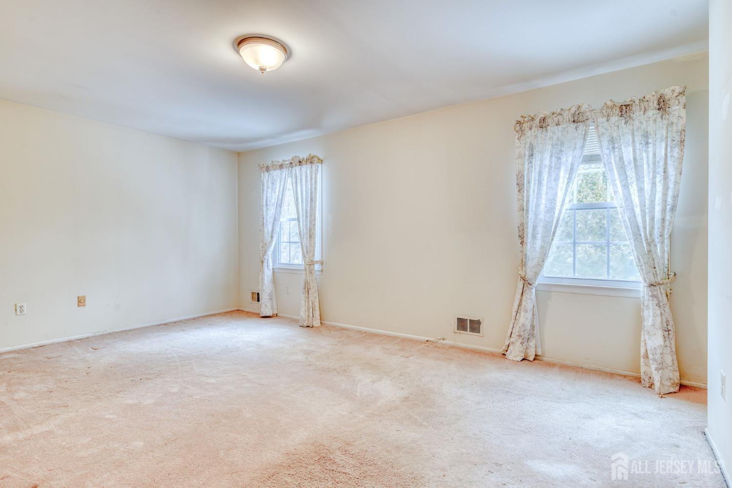 61 Ochs Avenue Milltown, NJ 08850 - Photo 20 of 29 an empty room with windows and closet