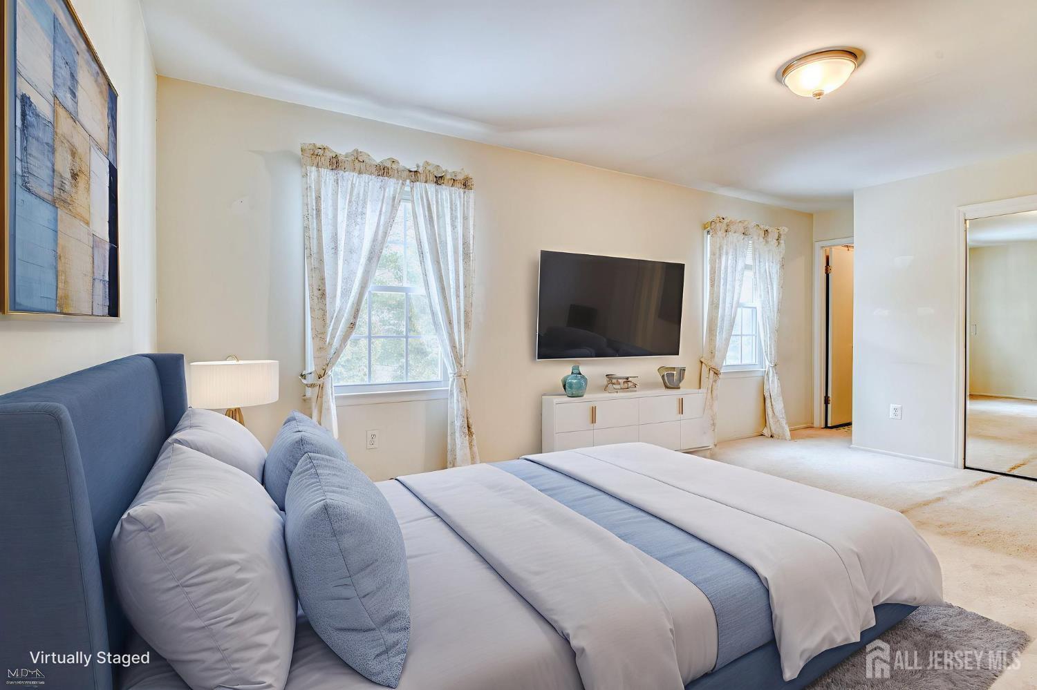 61 Ochs Avenue Milltown, NJ 08850 - Photo 22 of 29 a bedroom with a bed and a flat screen tv