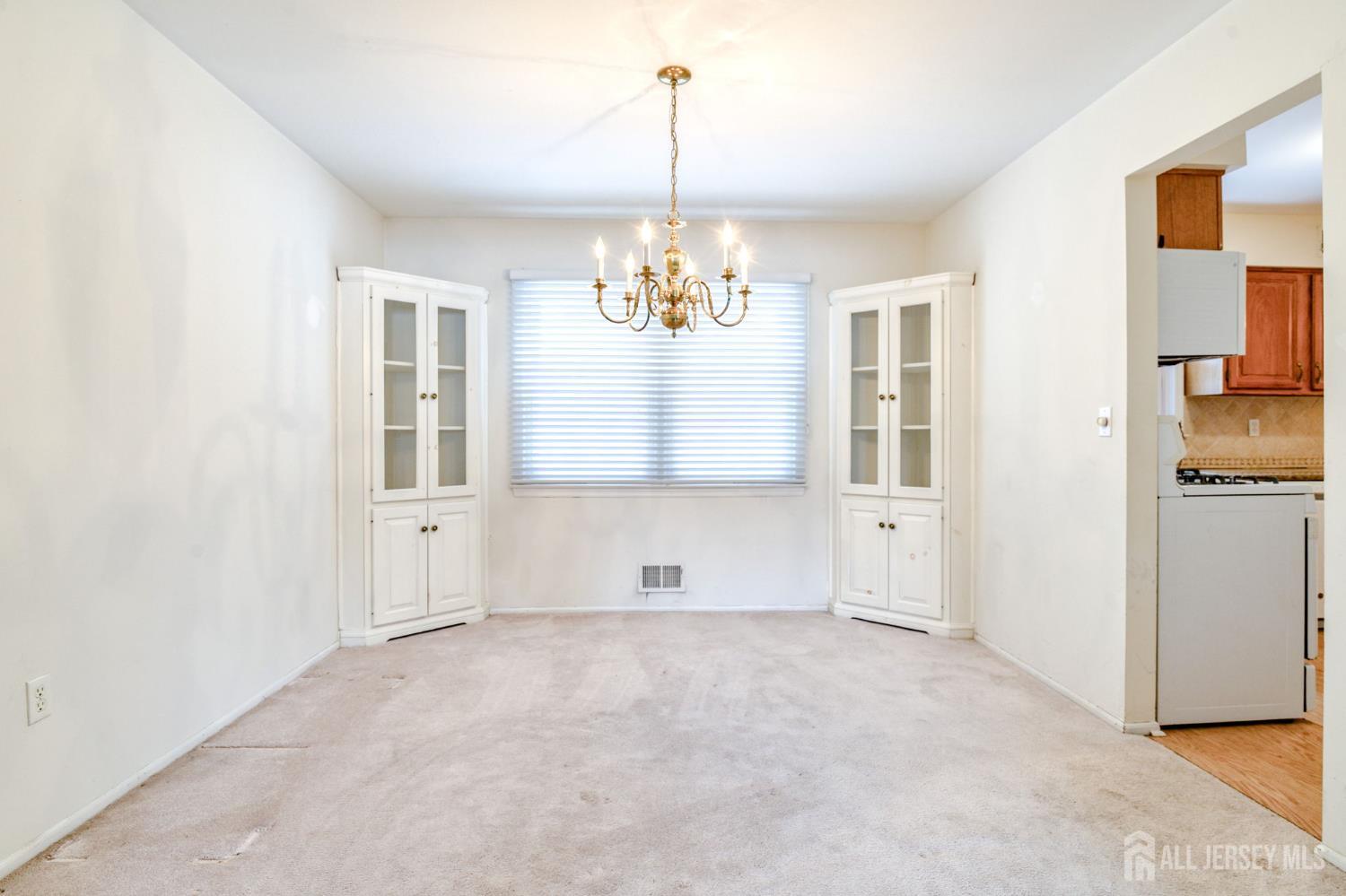 61 Ochs Avenue Milltown, NJ 08850 - Photo 5 of 29 a view of an empty room with a window