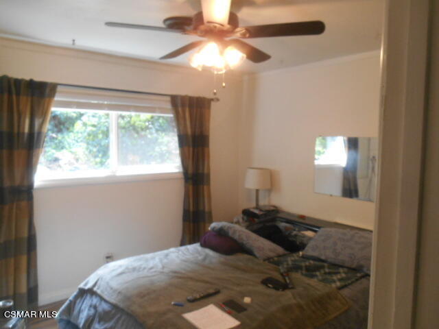 1123 Katherine Road Simi Valley, CA 93063 - Photo 7 of 10 a bedroom with a bed and a chandelier