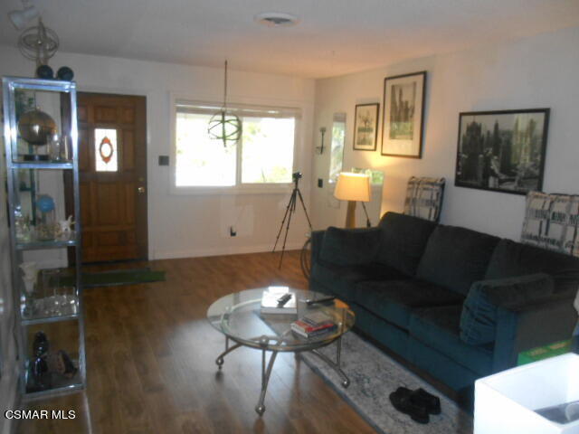 1123 Katherine Road Simi Valley, CA 93063 - Photo 9 of 10 a living room with furniture a window and a flat screen tv