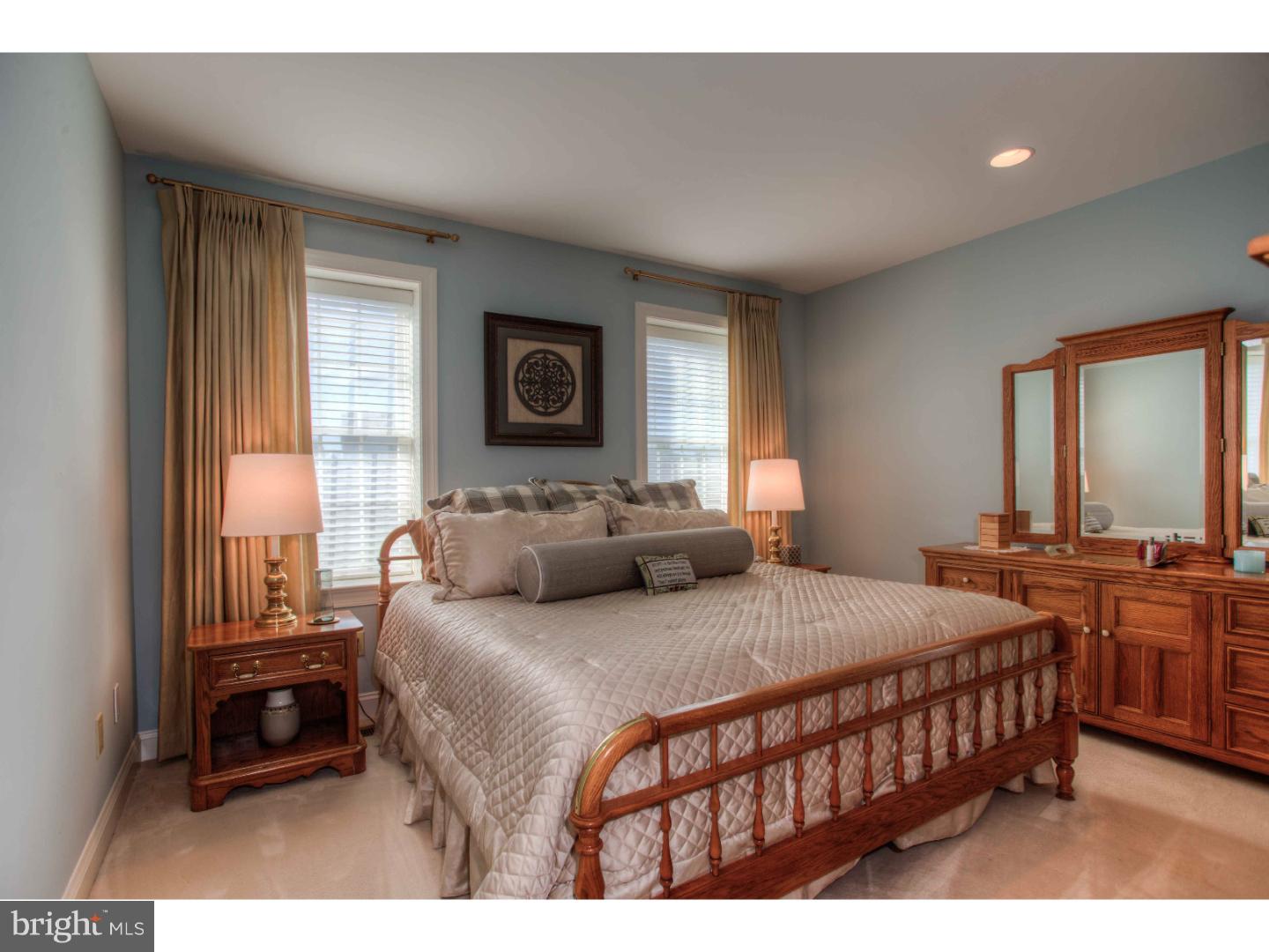 1033 Whitegate Road Wayne, PA 19087 - Photo 14 of 23 a bedroom with a bed a bookshelf and a window