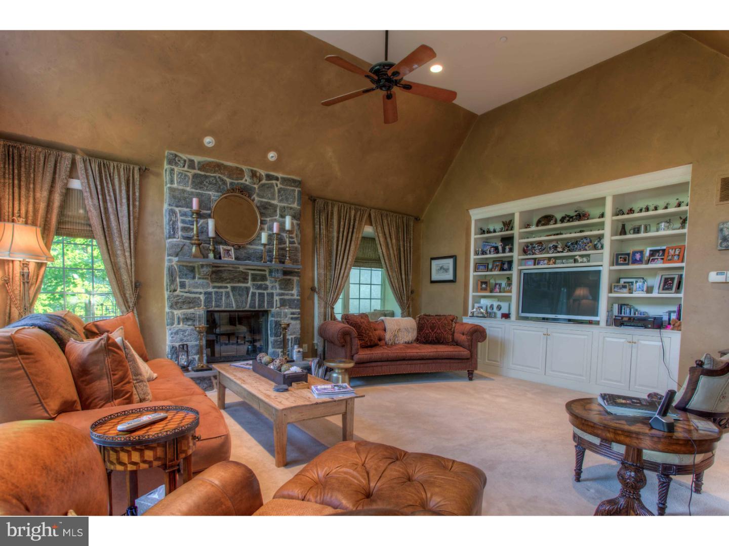 1033 Whitegate Road Wayne, PA 19087 - Photo 8 of 23 a living room with furniture and a fireplace