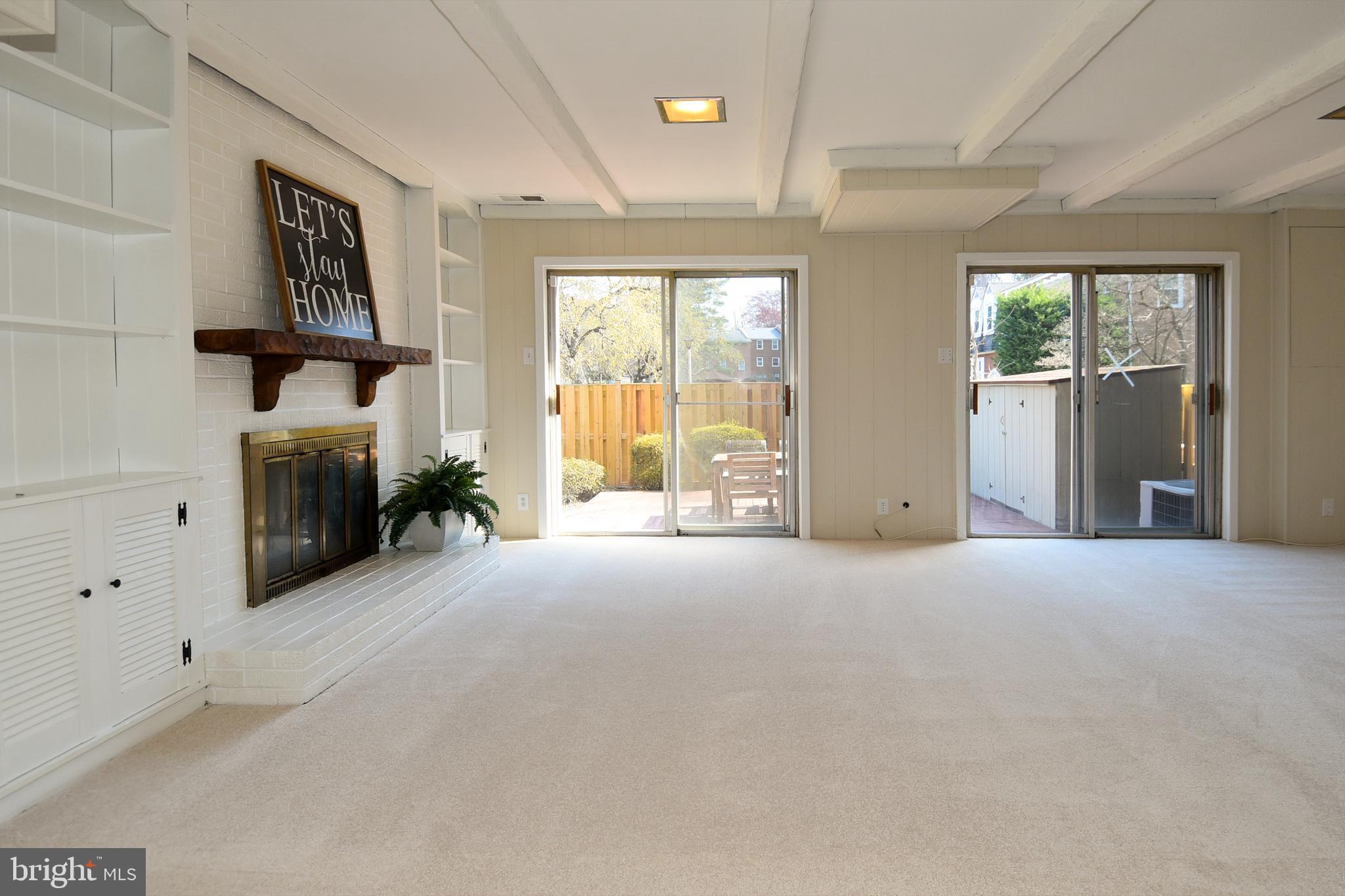 3249 Victor Circle Annandale, VA 22003 - Photo 19 of 33 Basement with sliding doors, storage and fireplace