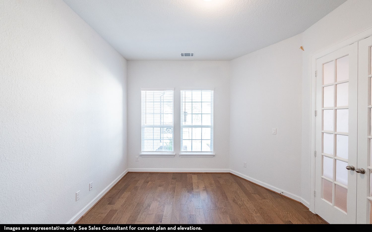 602 Johnston Drive Rosharon, TX 77583 - Photo 12 of 21 an empty room with wooden floor and windows