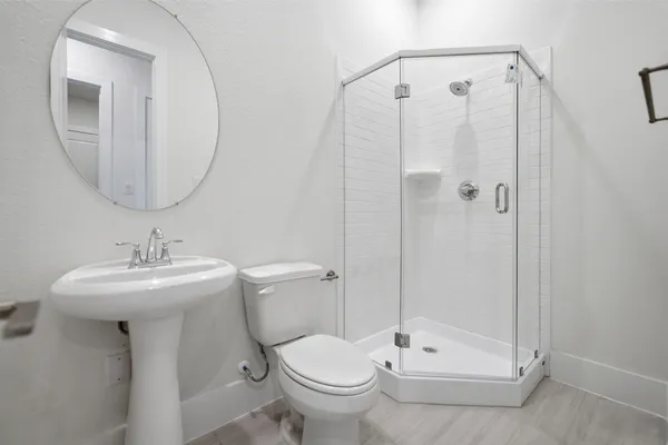 a view of a big room with windows and a kitchen