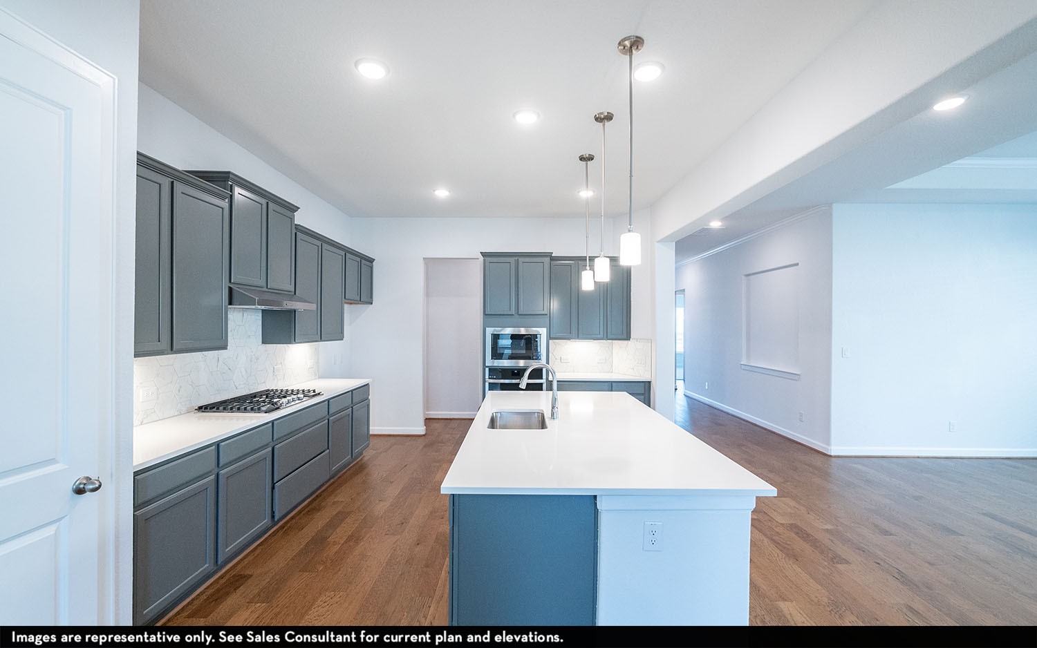 602 Johnston Drive Rosharon, TX 77583 - Photo 2 of 21 a kitchen with kitchen island white cabinets and stainless steel appliances
