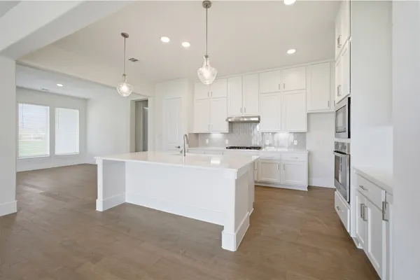 a spacious bathroom with a double vanity sink and a mirror