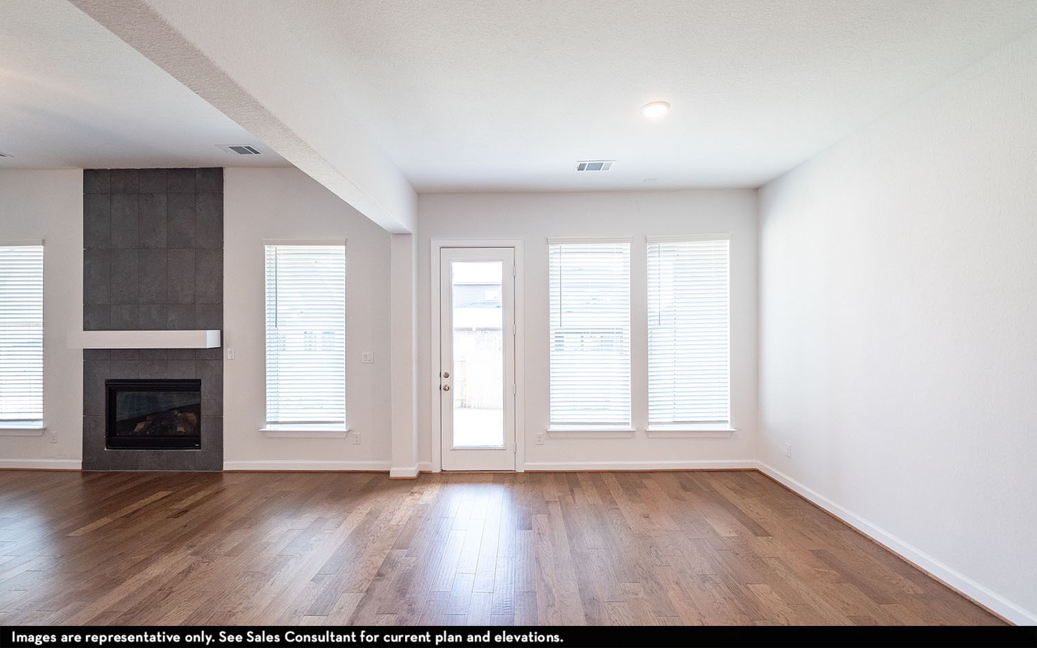 602 Johnston Drive Rosharon, TX 77583 - Photo 8 of 21 an empty room with windows and fireplace