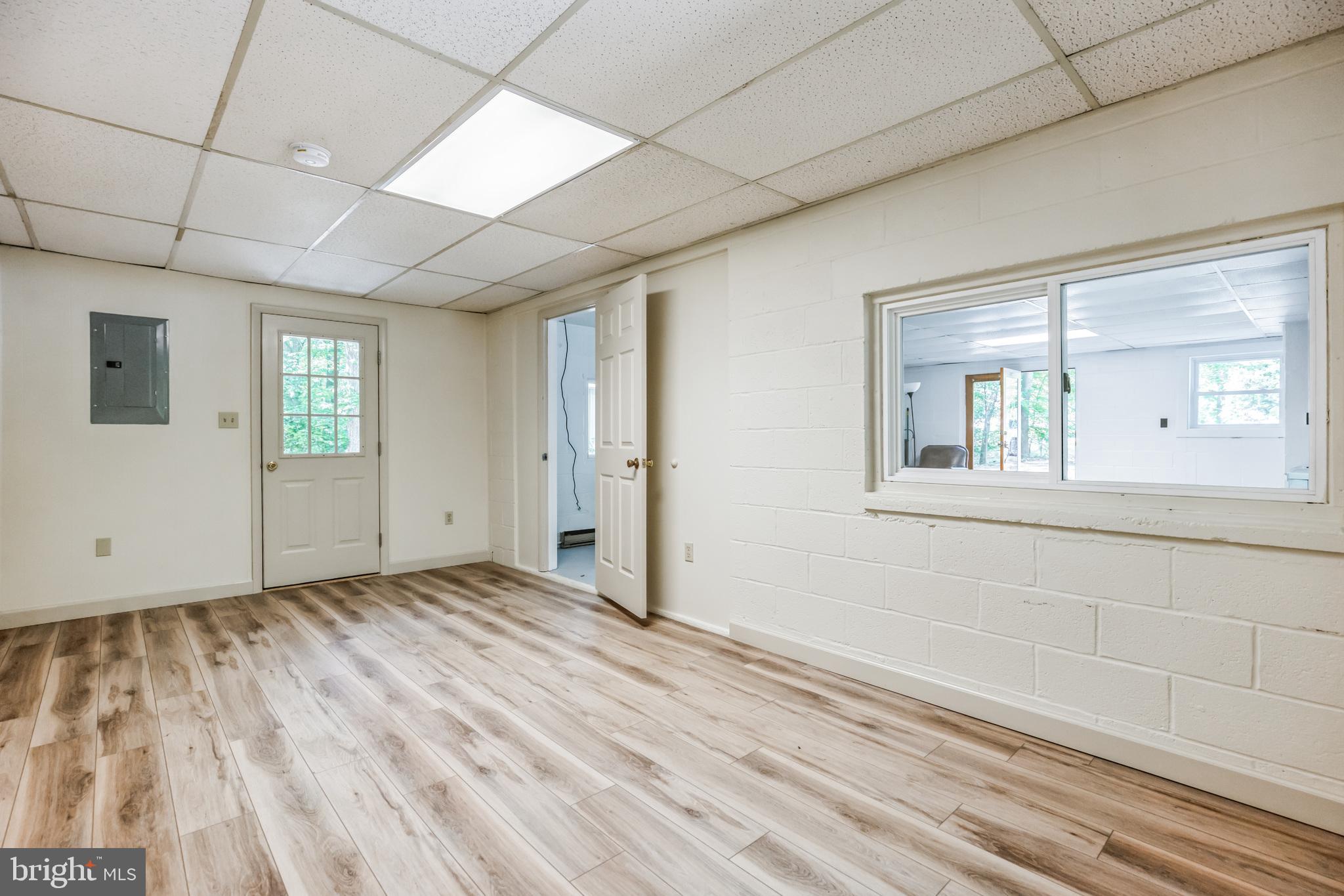 11425 Mill Bridge Road Lusby, MD 20657 - Photo 22 of 40 a view of empty room with wooden floor and fan