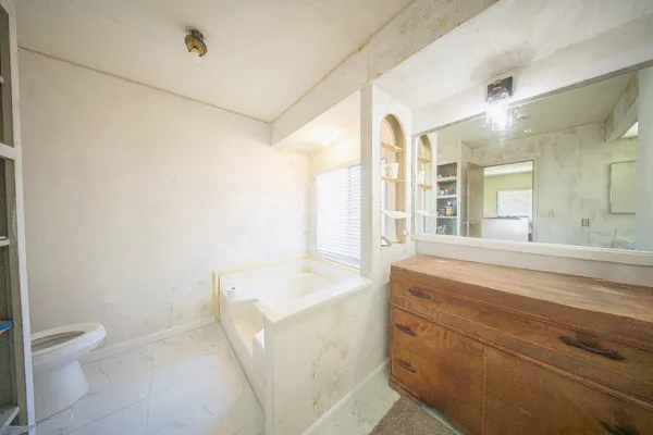 a bathroom with a sink a toilet and a bathtub