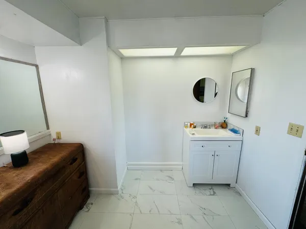 a bathroom with a sink toilet and tub