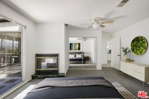 a bathroom with a double vanity sink toilet and shower