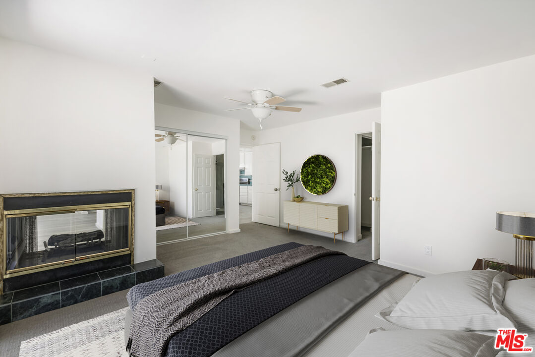 4013 Division Street Los Angeles, CA 90065 - Photo 28 of 66 a bedroom with a bed and a fireplace
