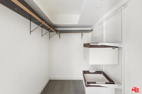 an empty room with a empty space and a ceiling fan