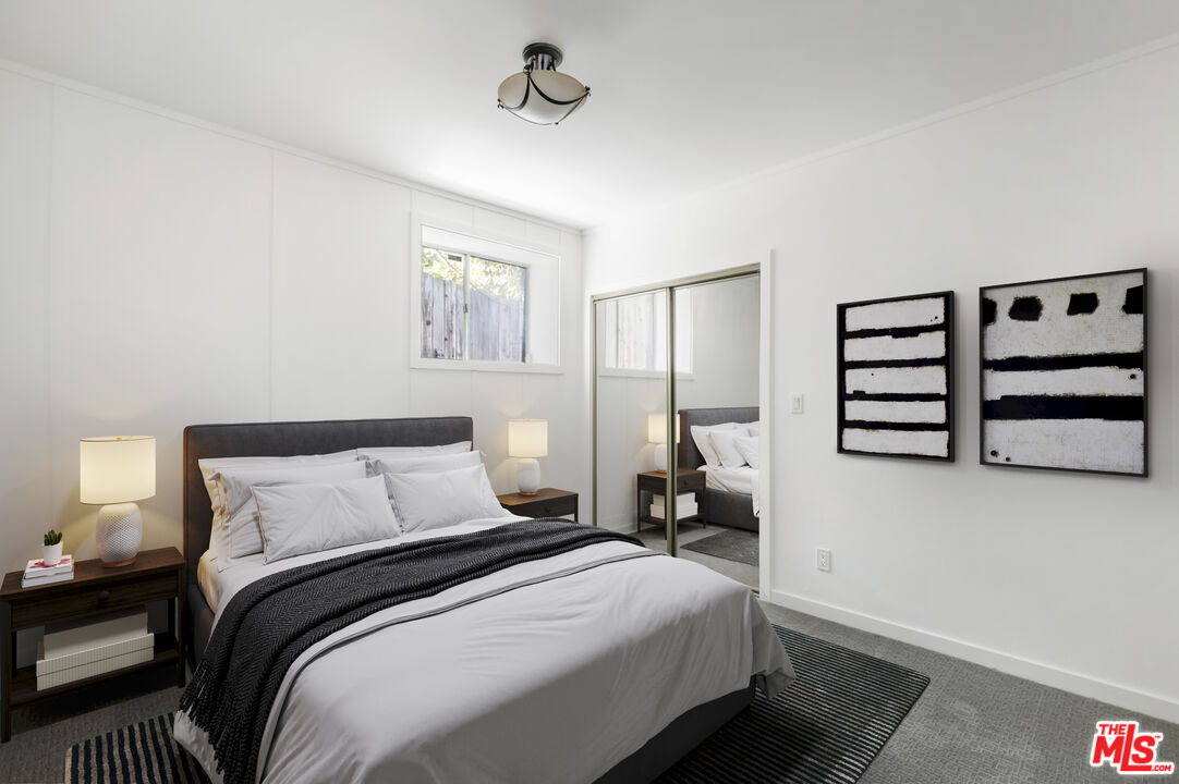 4013 Division Street Los Angeles, CA 90065 - Photo 40 of 66 a bedroom with a bed and a night stand