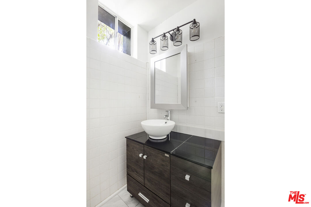 4013 Division Street Los Angeles, CA 90065 - Photo 44 of 66 a bathroom with a sink and a mirror