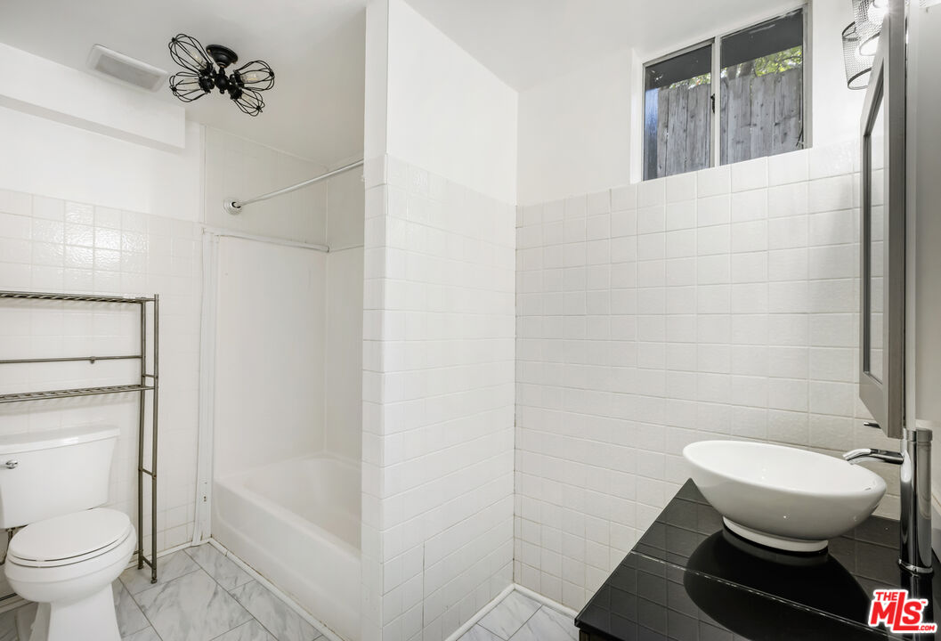 4013 Division Street Los Angeles, CA 90065 - Photo 45 of 66 a bathroom with a toilet and a shower