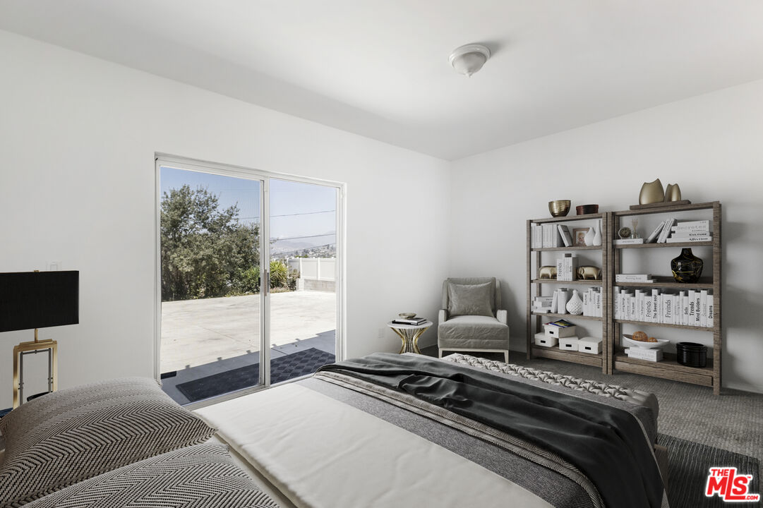 4013 Division Street Los Angeles, CA 90065 - Photo 48 of 66 a bedroom with a bed and a flat tv screen