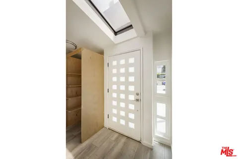 a kitchen with stainless steel appliances a refrigerator and a stove