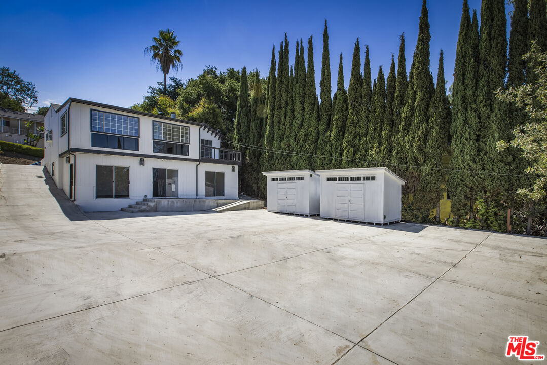 4013 Division Street Los Angeles, CA 90065 - Photo 60 of 66 a view of a house with a yard and a car park