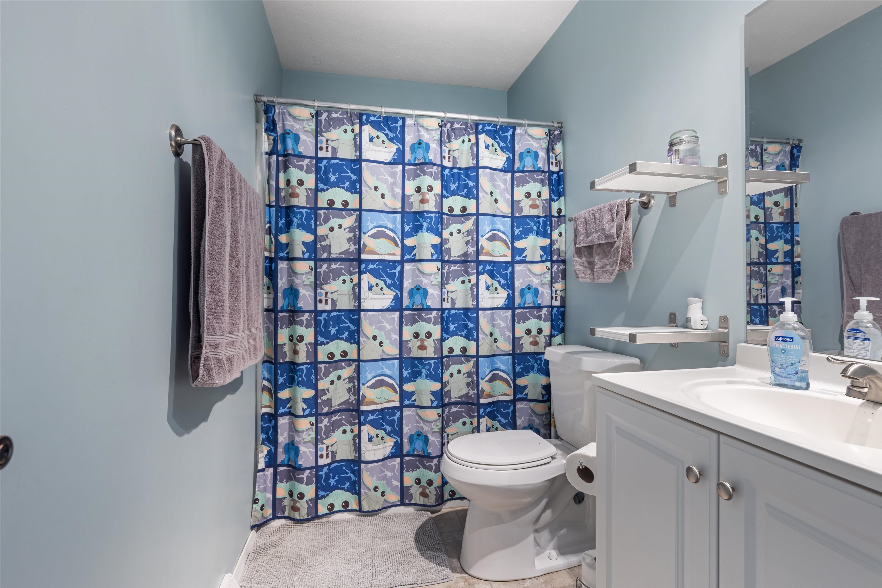 4031 Fairfax Road Roscoe, IL 61073 - Photo 11 of 23 a bathroom with a toilet sink shower and mirror