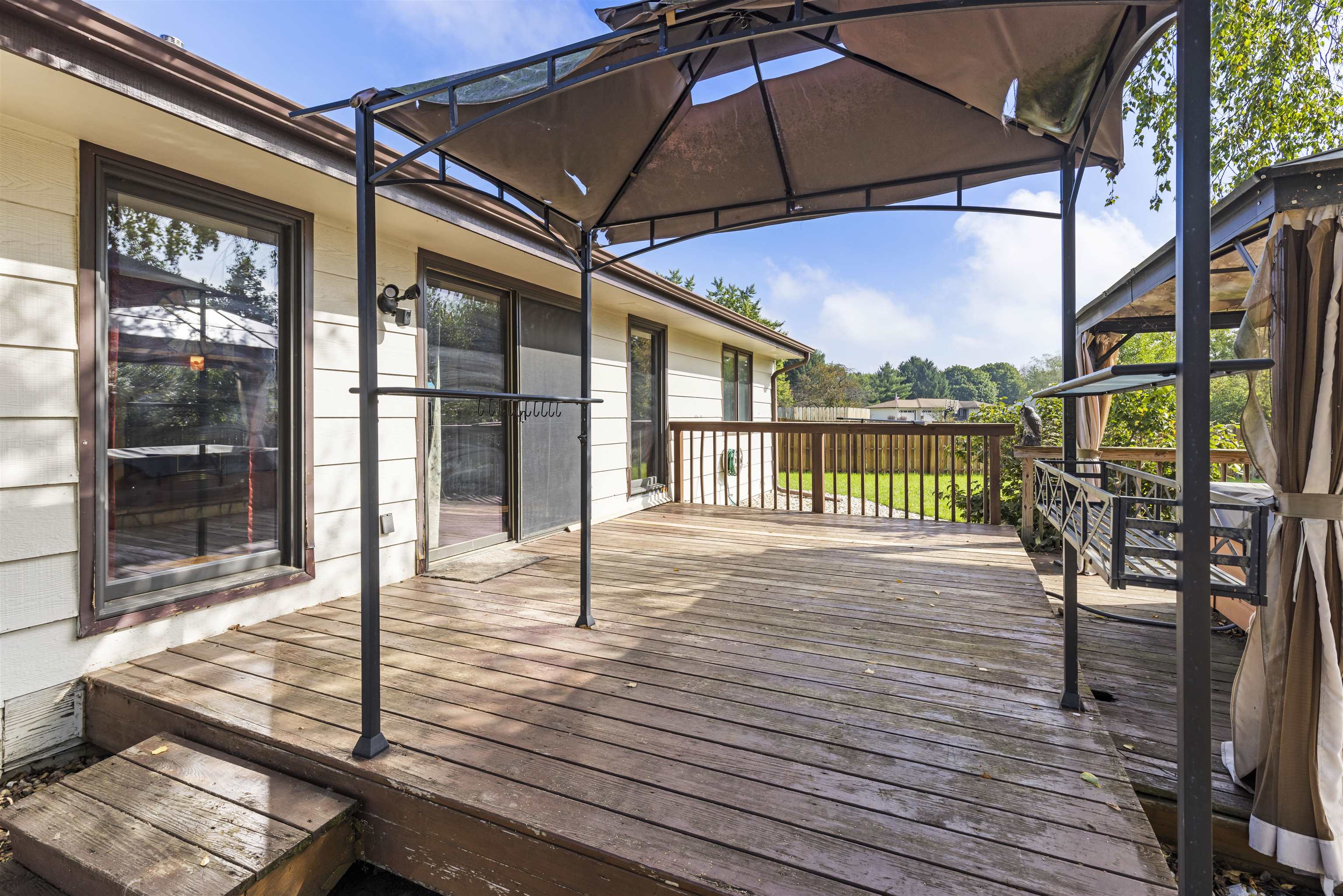 4031 Fairfax Road Roscoe, IL 61073 - Photo 16 of 23 a view of a balcony with wooden floor