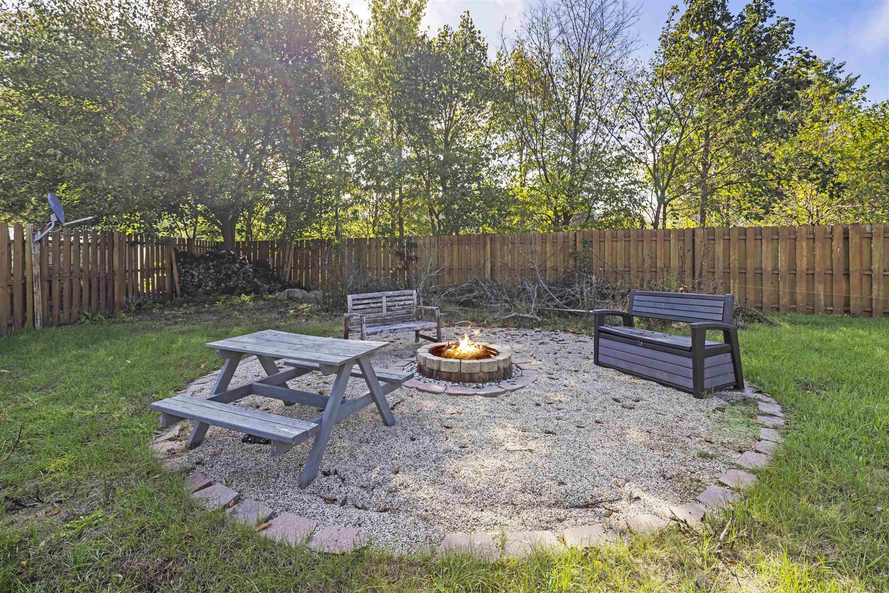4031 Fairfax Road Roscoe, IL 61073 - Photo 18 of 23 a view of a bench in the garden