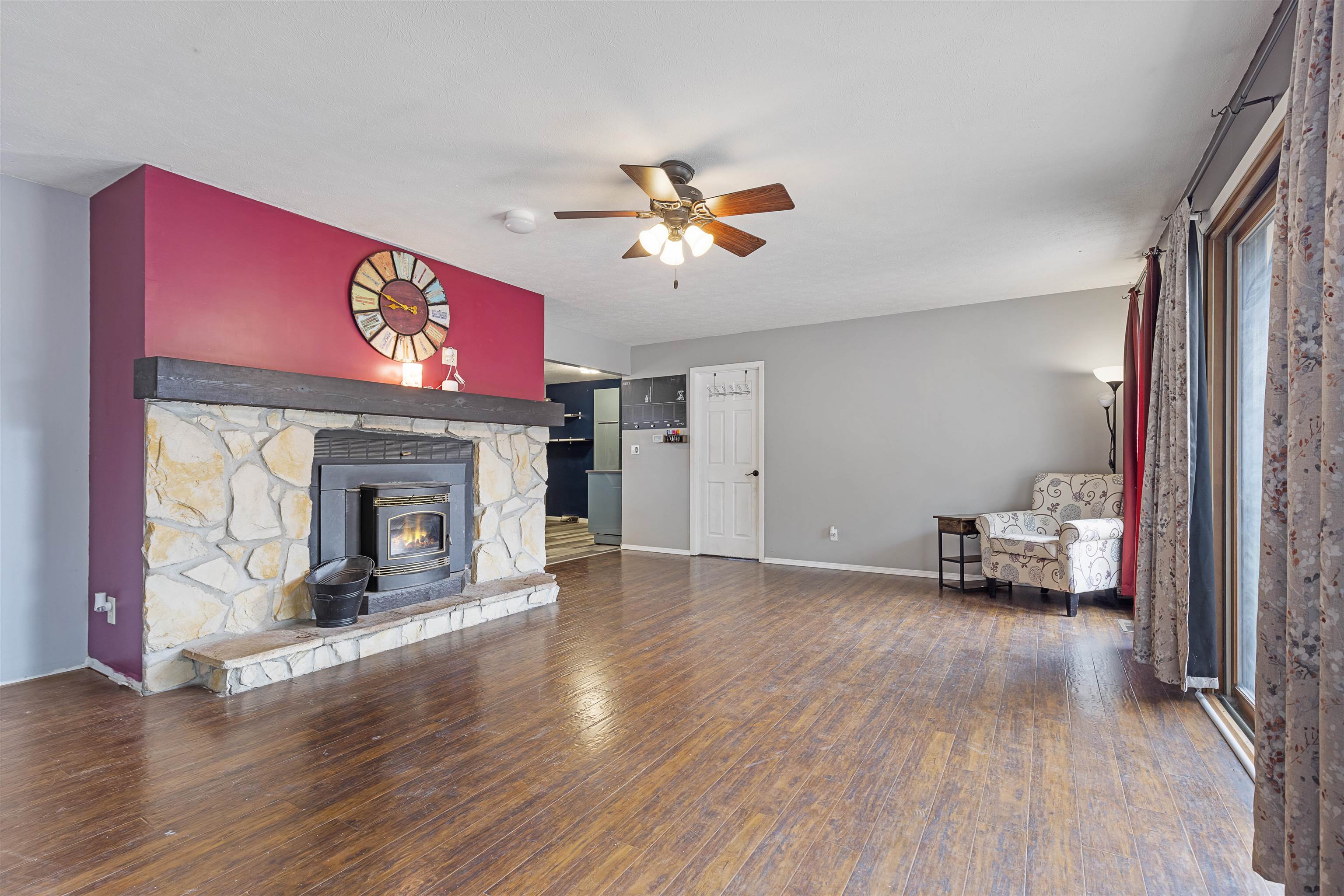 4031 Fairfax Road Roscoe, IL 61073 - Photo 2 of 23 a living room with furniture and a fireplace