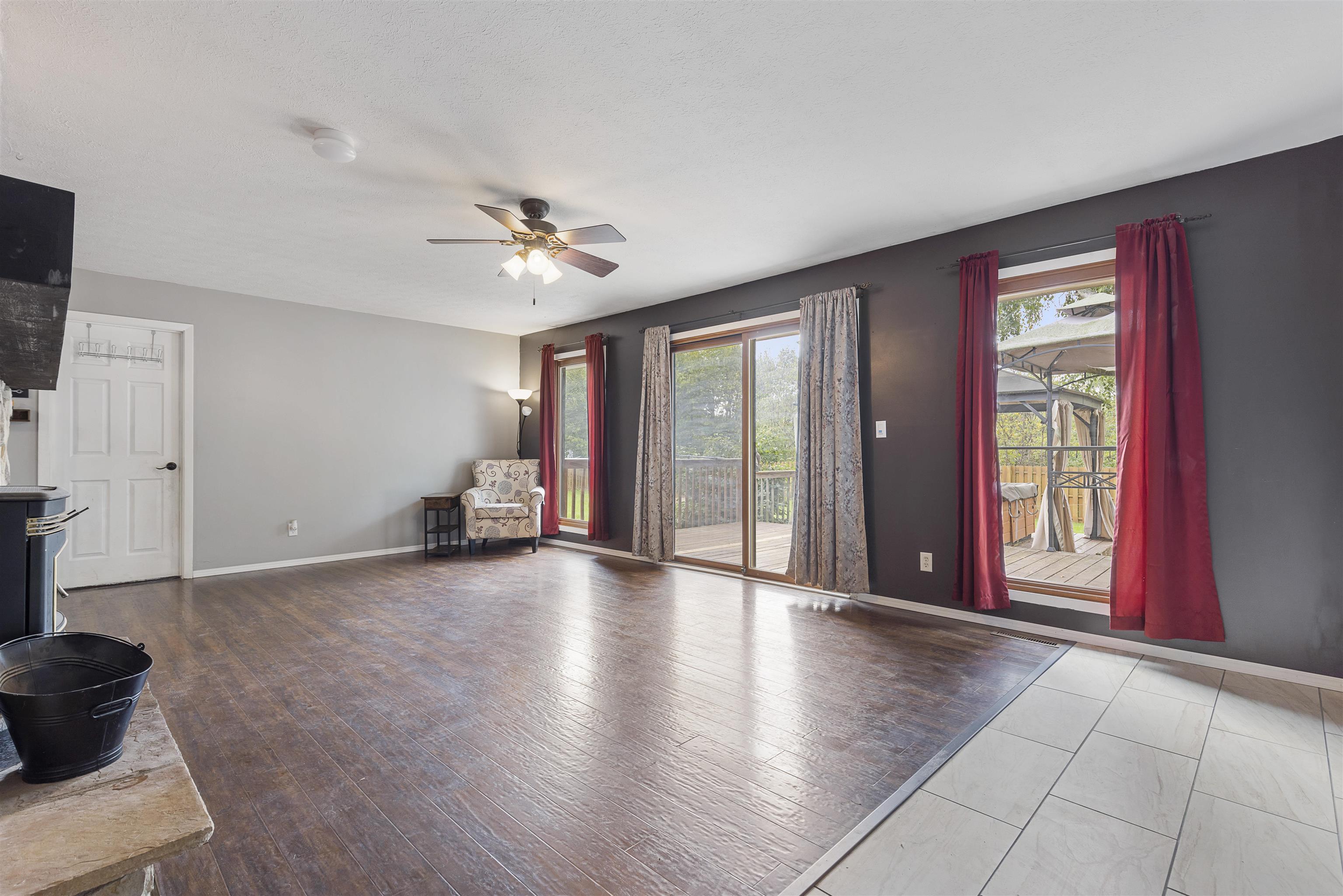 4031 Fairfax Road Roscoe, IL 61073 - Photo 3 of 23 a view of an empty room with a window and a kitchen