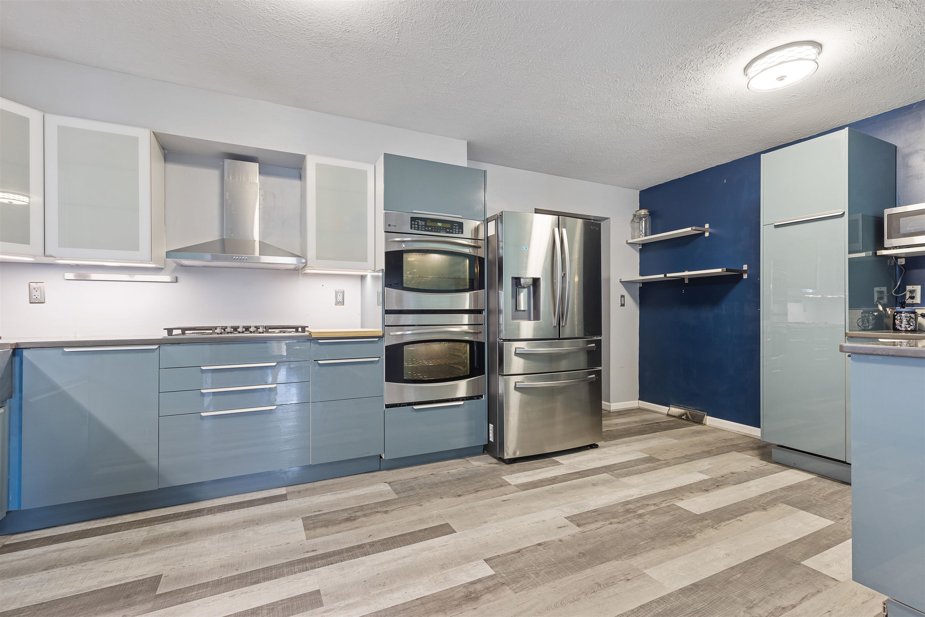4031 Fairfax Road Roscoe, IL 61073 - Photo 4 of 23 a kitchen with stainless steel appliances granite countertop a refrigerator and a stove