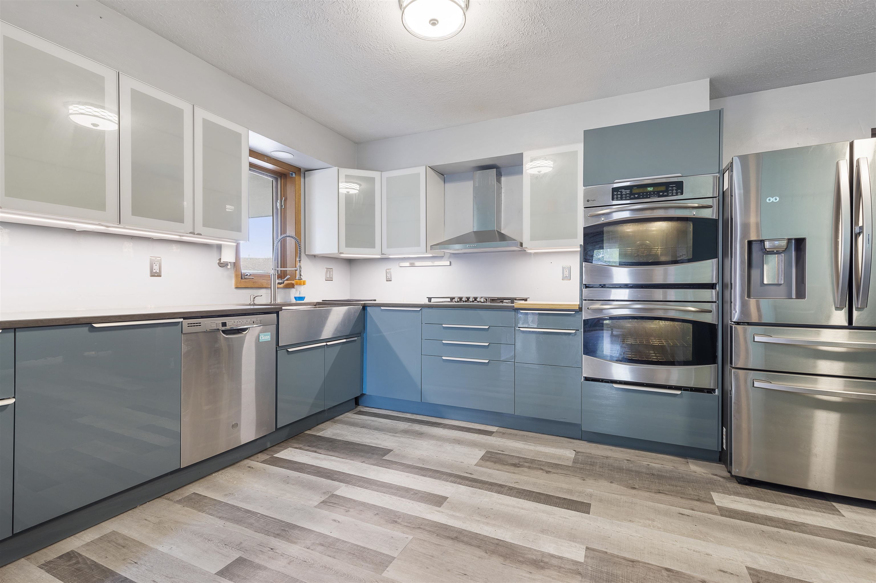4031 Fairfax Road Roscoe, IL 61073 - Photo 5 of 23 a kitchen with a sink stainless steel appliances and cabinets