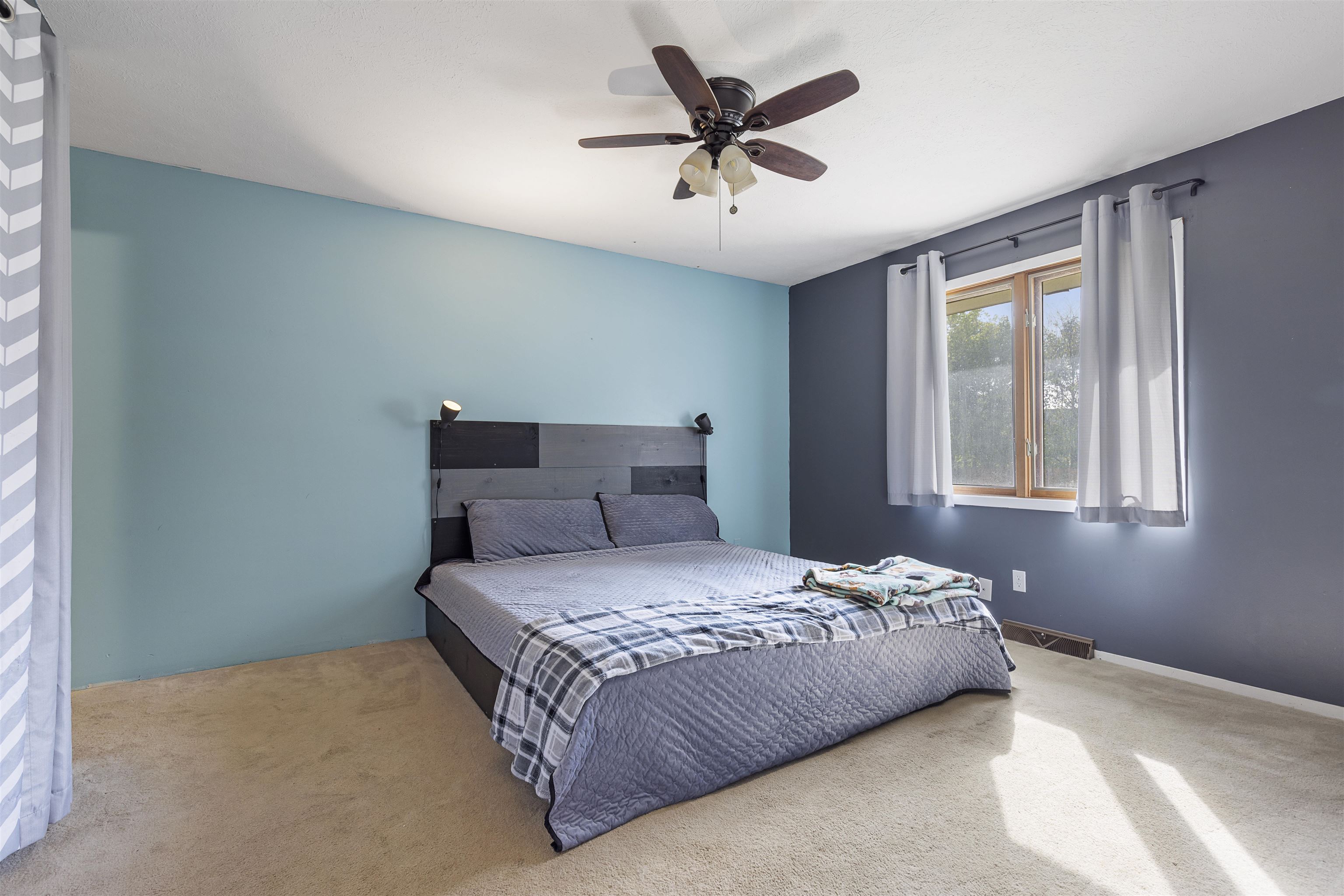 4031 Fairfax Road Roscoe, IL 61073 - Photo 7 of 23 a bedroom with a bed and a window