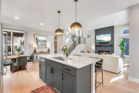 a large kitchen with a table and chairs