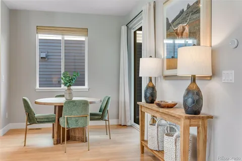 a view of a dining room with furniture and a window
